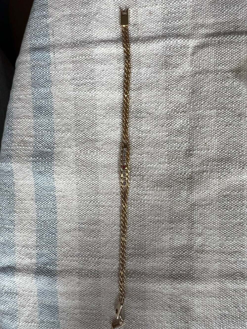 Gold Tone Rope Chain Bracelet With Diamond Accents and Ruby Center Stone